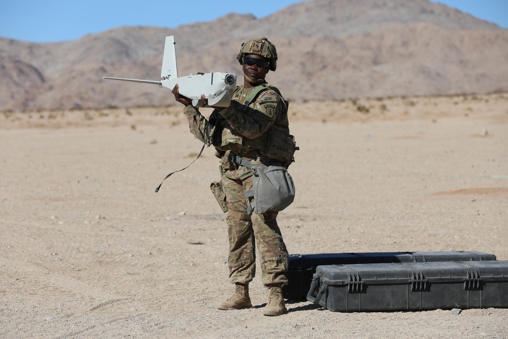 Special operations advisor preparing a small unmanned aerial system in the field