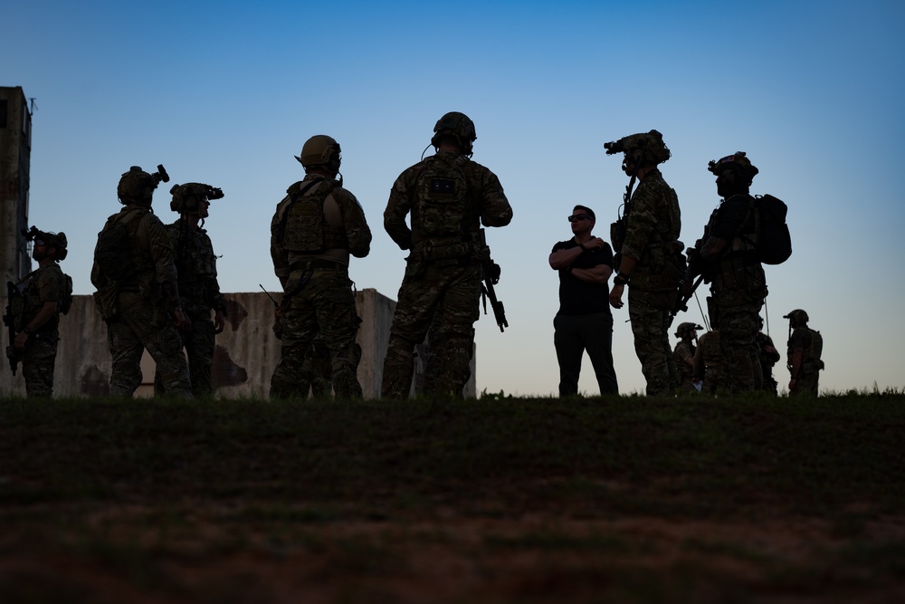 Special operations personnel receiving a field briefing